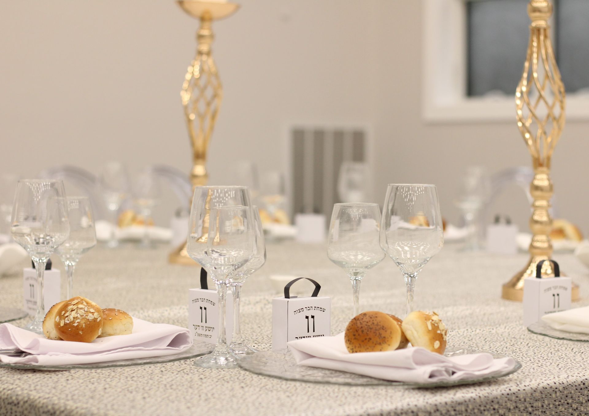 Elegant place setting with fresh rolls at Rose Garden Hall